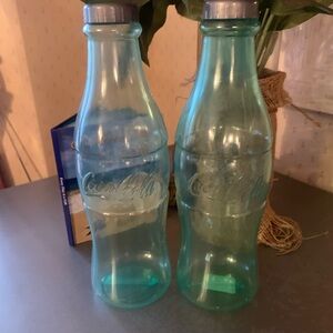 Coca-Cola bottle banks, 2 pk.savings bank for coins or bills. 12 inches tall.